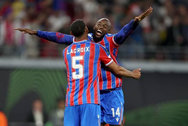 Jean-Philippe Mateta of Crystal Palace (right) celebrates with teammate Maxence Lacroix winning the UEFA Conference League Crystal Palace v Rayo Vallecano, UEFA Conference League, Final, Football, Red Bull Arena, Leipzig, Germany - 27 May 2026Leipzig Red Bull Arena Germany EDITORIAL USE ONLY No use with unauthorised audio, video, data, fixture lists, club league logos or live services. Online in-match use limited to 120 images, no video emulation. No use in betting, games or single club league player publications.  Copyright: xKieranxMcManus Shutterstockx 16898266di