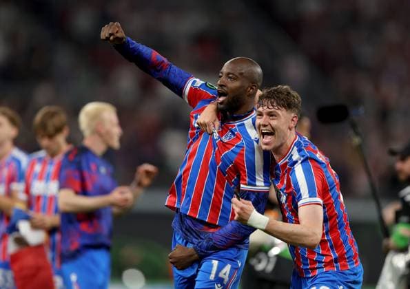 Jean-Philippe Mateta of Crystal Palace celebrates with teammate Jörgen Strand Larsen (right) winning the UEFA Conference League Crystal Palace v Rayo Vallecano, UEFA Conference League, Final, Football, Red Bull Arena, Leipzig, Germany - 27 May 2026Leipzig Red Bull Arena Germany EDITORIAL USE ONLY No use with unauthorised audio, video, data, fixture lists, club league logos or live services. Online in-match use limited to 120 images, no video emulation. No use in betting, games or single club league player publications.  Copyright: xKieranxMcManus Shutterstockx 16898266dl