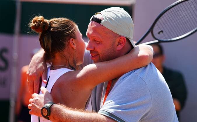 Oleksandra Oliynykova hugs her father Denis, currently on leave from the Ukrainian army to watch his daughter play, after making round three with a three set win over Kimberly Birrell French Open Tennis, Day Five, Tennis, Roland Garros, Paris, France - 28 May 2026Paris Roland Garros France EDITORIAL USE ONLY No use with unauthorised audio, video, data, fixture lists, club league logos or live services. Online in-match use limited to 120 images, no video emulation. No use in betting, games or single club league player publications.  Copyright: xJavierxGarcia Shutterstockx 16898263a