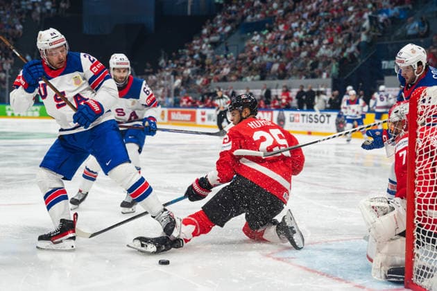 FRIBOURG, FRIBOURG - MAY 28: Mathieu Olivier of the United States battles with Darnell Nurse of Canada during the 2026 IIHF World Championship, WM, Weltmeisterschaft quarterfinal match between Canada and the United States at BCF Arena on May 28, 2026 in Fribourg, Fribourg, Switzerland. Copyright: xLivioxBaeriswylx xSPPx Sportspressphoto_SPR156147
