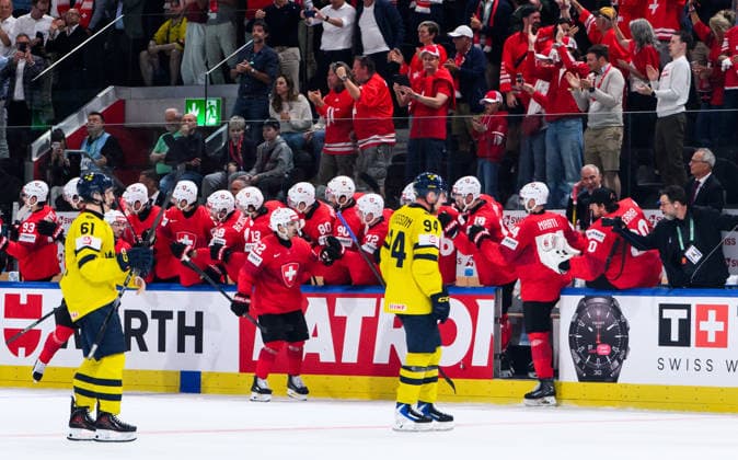 260528 Viggo Björck and Joel Persson of Sweden look dejected while Nino Niederreiter of Switzerland celebrates after 2 1 during the 2026 IIHF Ice Hockey World Championship quarterfinal match between Switzerland and Sweden on May 28, 2026 in Zürich Photo Jesper Zerman BILDBYRAN kod JZ JZ0733 ishockey ice hockey ishockey vm 2026 vm 2026 iihf world championship kvartsfinal quarterfinal quarterfinals switzerland schweiz sverige sweden bbeng depp jubel  Copyright: JESPERxZERMAN BB260528JZ134
