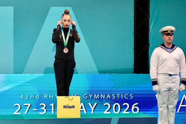 BULGARIA, VARNA - MAY 29, 2026: Silver medalist Sofia Krainska of Ukraine plugs in earphones during a victory ceremony at the 2026 European Rhythmic gymnastics, Rhythmische Sportgymnastik, RSG Championships. Russia s national team, Nationalteam is performing under the Russian flag and anthem. Igor Lenkin TASS  93157425
