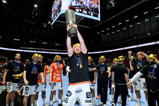 260529 IFK Kristianstads Herman Josefsson celebrates with the trophy after the final four in the Mens Handball League between HK Malmö and IFK Kristianstad on May 29, 2026 in Malmö  Copyright: MATHILDAxSCHULER BB260529MA123