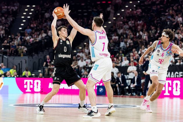 MUNICH, GERMANY - MAY 30: Neno Dimitrijevic (FC Bayern Muenchen, 0) controls the ball against Grayson Murphy (Telekom Baskets Bonn, 7) during the easyCredit Basketball Bundesliga Playoffs Semi-final match 1 between FC Bayern Muenchen vs. Telekom Baskets Bonn at SAP Garden on match 1 of easyCredit Basketball Bundesliga Playoffs Semi-final on May 30, 2026 in Munich, Germany. Bavaria Germany Copyright: xSteffiexWunderlx