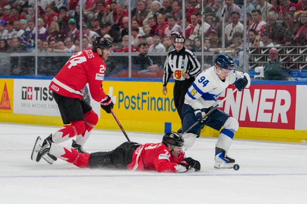 ZURICH, SWITZERLAND MAY 30 Konsta Helenius of Finland R take 2minutes penalty for tripping against Macklin Celebrini of Canada lied during the 2026 IIHF Ice Hockey World Championship Switzerland game between Canada and Finland at Swiss Life Arena on May 30, 2026 in Zurich, Zurich Zurich Swiss Life Arena Zurich Switzerland Switzerland Copyright: xJustPictures.ch JarixPestelaccix jp-en-EuSpIm-JP6_JAR_Canada_Finland_30May2026_00084