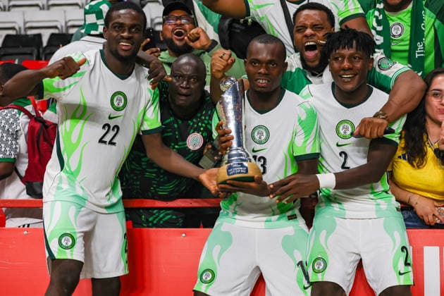 Jamaica v Nigeria, Unity Cup London 2026, Cup Final Nigeria defender Al-Ameen Kehinde Tijani (22), Nigeria defender Elias Ochobi (13) and Nigeria defender Chibueze Oputa (2) lifts the Unity Cup Trophy in front of the visiting fans after the Unity Cup London 2026 Final match between Jamaica and Nigeria at The Valley, London, UK on 30 May 2026. London The Valley Greater London UK Editorial use only , Copyright: xToyinxOshodix PSI-24348-0092