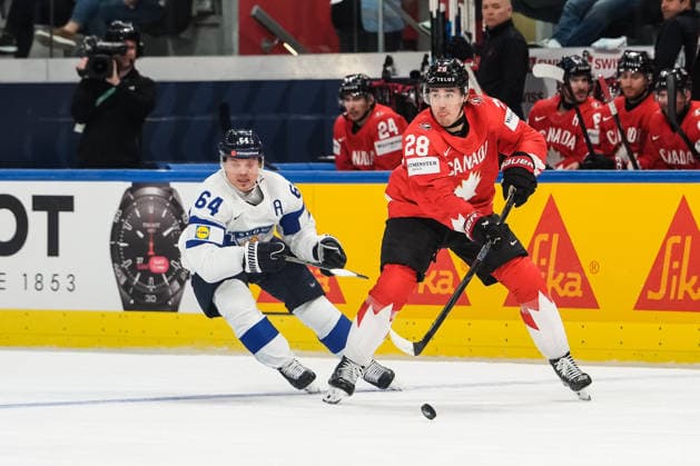 xxkeikkaxx 20260530 Swiss Life Arena, Zurich, Switzerland. IIHF Ice hockey, Eishockey World Championships Semifinal match Canada vs Finland Zach Whitecloud (28) of Team Canada passes the puck while being pursued by Mikael Granlund (64) of Team Finland. Photo by Pasi Suokko All Over Press  1.06241327