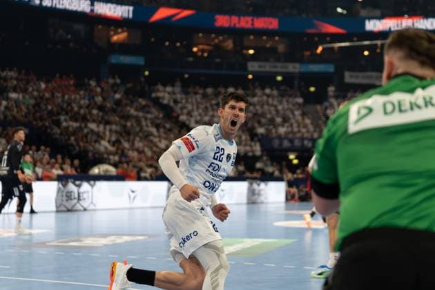 Benjamin Richert 22 Montpellier HB opens his mouth and cheers exuberantly on the pitch In the background you can see a player from SG Flensburg Handewitt, on the right in the picture the Flensburg goalkeeper in the green shirt Benjamin Richert 22 Montpellier HB cheers during the 3rd Place Match Copyright: xPhilippHeistx