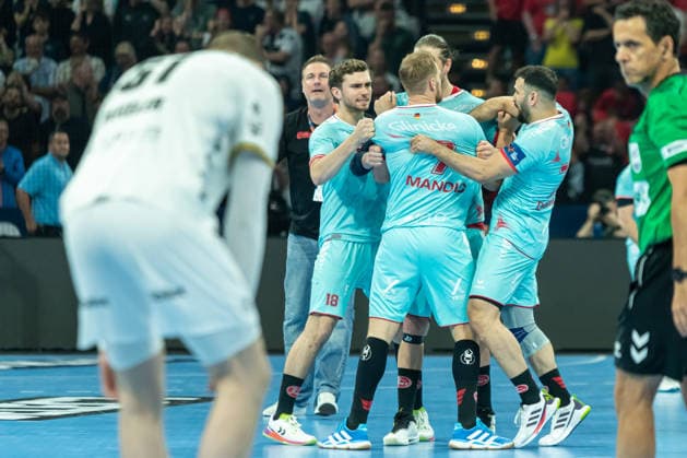 Florian Drosten MT Melsungen , goalkeeper Kristof Palasics MT Melsungen , David Mandic MT Melsungen and Mohamed Amine Darmoul MT Melsungen celebrate after the win during the handball final of the Winamax EHF Finals 2026 between THW Kiel and MT Melsungen at Barclays Arena on May 31, 2026 in Hamburg, Germany
