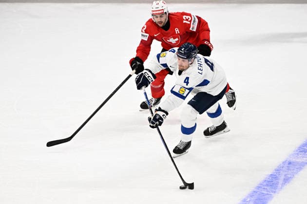 LKS 20260531 4 Mikko Lehtonen of Finland and 13 Nico Hischier of Switzerland fights for the puck during the 2026 IIHF Ice hockey, Eishockey World Championships final match between Switzerland and Finland in Zurich on May 31, 2026. - RONI REKOMAA Zürich Switzerland QOmyhD2Awpw  Copyright: xRonixRekomaax QOmyhD2Awpw