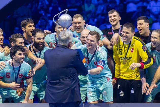 Timo Kastening MT Melsungen gets the EHF Cup at the award ceremony during the handball final of the Winamax EHF Finals 2026 between THW Kiel and MT Melsungen at Barclays Arena on May 31, 2026 in Hamburg, Germany