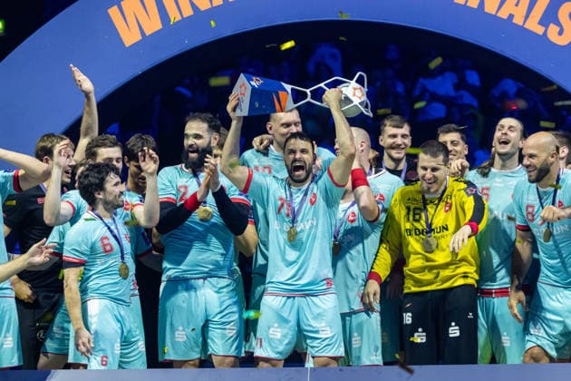 Mohamed Amine Darmoul MT Melsungen lifts the EHF Cup at the award ceremony during the handball final of the Winamax EHF Finals 2026 between THW Kiel and MT Melsungen at Barclays Arena on May 31, 2026 in Hamburg, Germany