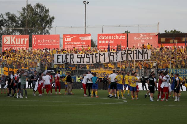 01 06 2026, Men, Football, Season 2025 2026, Relegation to 3 League FC Wuerzburger Kickers 1 FC Lokomotive Leipzig LOK Fans banner Your system is sick Wuerzburg FLYERALARM Arena Bayern Germany