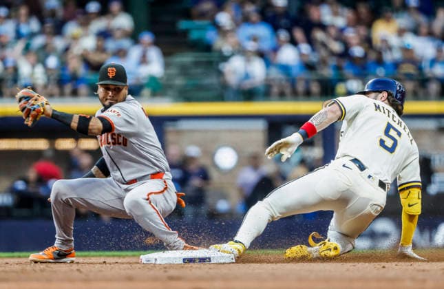 Milwaukee Brewers center fielder Garrett Mitchell (R) slides into second base on San Francisco Giants second baseman Luis Arraez (L) after hitting a double in the fourth inning of the MLB, Baseball Herren, USA game between the San Francisco Giants and the Milwaukee Brewers at American Family Field in Milwaukee, Wisconsin on Tuesday, June 2, 2026.  MIL20260602816 TANNENxMAURY