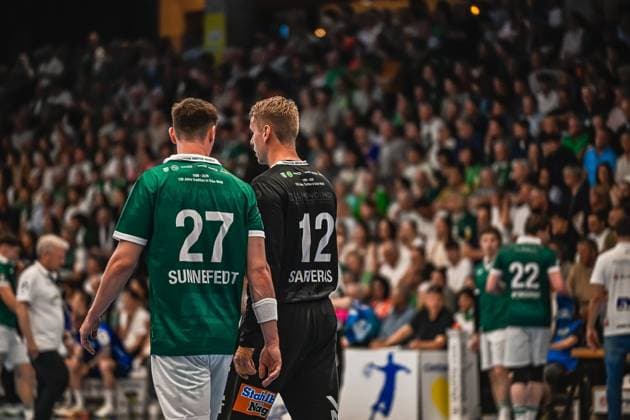 Oskar Sunnefeldt 27 Frisch Auf Göppingen and goalkeeper Kristian Sæveras 12 Frisch Auf Göppingen stand next to each other and talk during the game Erik Persson 22 Frisch Auf Göppingen can be seen in the background Oskar Sunnefeldt 27 and Kristian Sæveras 12 Frisch Auf Göppingen in conversation Copyright: xspeedshotx xDorianfrickx