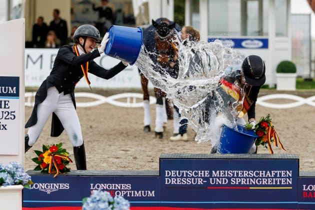 BALVE LONGINES Balve Optimum 2026, BALVE LONGINES Balve Optimum 2026 BAUMGUERTEL Lucie Anouk GER , OATLEY Rose GER , GAGEL Pia Carlotta GER Champion ceremony Champagne Shower Champion Bath PIAFF FOÌˆRDERPREIS Preis der Liselott Schindling Stiftung German Championships Dressage U25 U25 Grand Prix Balve, Equestrian Center Schloss Wocklum 05 June 2026