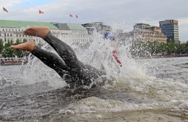 Ironman in Hamburg 2026 participants in the Age Grouper class at the swim start in the Binnenalster