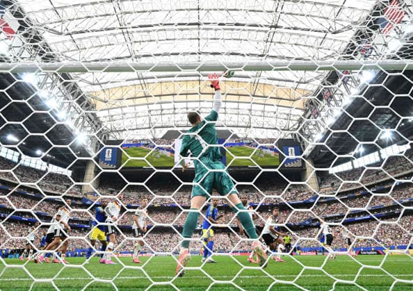 (260615) -- HOUSTON, June 15, 2026 -- Manuel Neuer (C), goalkeeper of Germany, makes a save during the group E match between Germany and Curacao at the 2026 FIFA World Cup, WM, Weltmeisterschaft, Fussball at Houston Stadium in Houston, the United States, June 14, 2026. ) (SP)U.S.-HOUSTON-FOOTBALL-FIFA WORLD CUP-GROUP E-GER VS CUW XiaoxYijiu