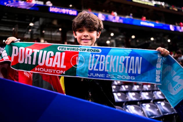 260623 A child holds up a match-day scarf ahead of the 2026 FIFA World Cup soccer match between Portugal and Uzbekistan on June 23, 2026 in Houston. Photo by Ludvig Thunman. BILDBYRAN code LT LT0803 soccer football fotball World Cup soccer World Cup 2026 FIFA World Cup 2026 Day 13 BBENG audience scarf,detected_source_language  Copyright: LUDVIGxTHUNMAN BB260623LT008