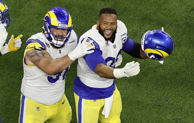 USA AMERICAN FOOTBALL SUPER BOWL LVI Los Angeles Rams at Cincinnati Bengals epa09754439 Los Angeles Rams Greg Gaines (L) and Aaron Donald (R) celebrate after stopping the Cincinnati Bengals on fourth down with second left in Super Bowl LVI at SoFi Stadium in Inglewood, California, USA, 13 February 2022. The annual Super Bowl is the Championship game of the NFL, American Football Herren, USA between the AFC Champion and the NFC Champion and has been held every year since January of 1967. Inglewood United States  Copyright: xETIENNExLAURENTx