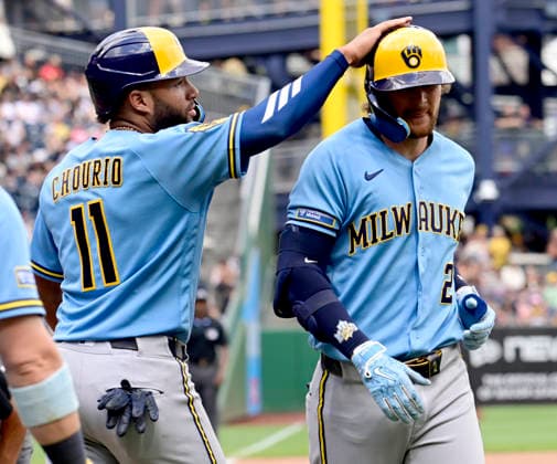 Milwaukee Brewers left fielder Jackson Chourio (11) taps Milwaukee Brewers second baseman Brice Turang (2) following his two run homer in the eighth inning of the Pittsburgh Pirates 14-5 win at PNC Park on Sunday, July 12, 2026 in Pittsburgh.  PIT2026071233 ArchiexCarpenter
