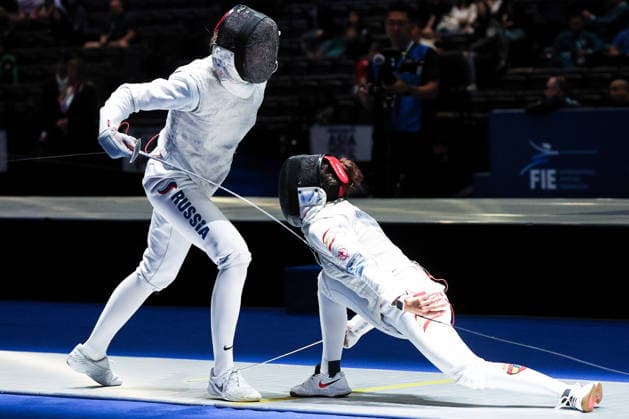 CHINA, HONG KONG - JULY 30, 2026: Athletes Anna Solovyova (L) of Russia and Maria Marino of Spain fight in their team foil bout during the 2026 Kerry Fencing World Championships. Mikhail Sinitsyn TASS  95618938