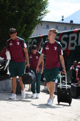 July 31, 2026, GER, Soccer, Men s, FC Augsburg, Bundesliga 1, 2026–2027 season, training camp, Achensee, arrival, Posthotel FC Augsburg has arrived at the team hotel for its training camp in Achenkirch. Thomas Kastanaras (left) and Anton Kade get off the bus in Achenkirch