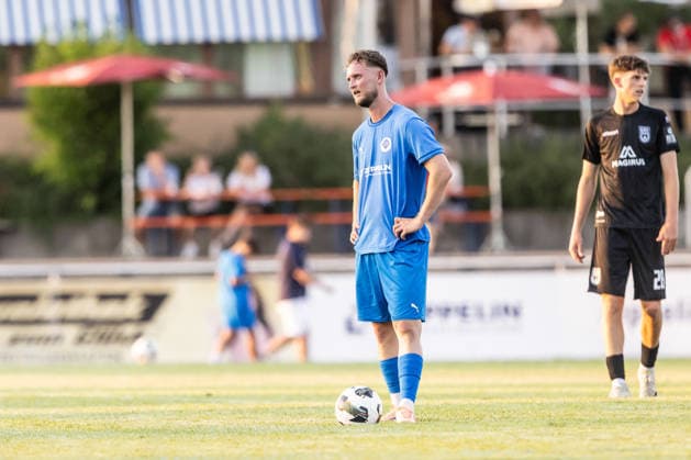 VfB Friedrichshafen vs. SSV Ulm 1846 Soccer, Wfv Cup, 2nd Round, Zeppelinstadion Friedrichshafen, July 29, 2026. Dennis Blaser of VfB Friedrichshafen, age 22, at the kickoff spot. VfB Friedrichshafen vs. SSV Ulm 1846 Soccer, WfV Cup, 2nd Round, Zeppelin Stadium, Friedrichshafen, July 29, 2026. Photo by Lucca Fundel. Friedrichshafen, Zeppelin Stadium, Baden-Württemberg, Germany