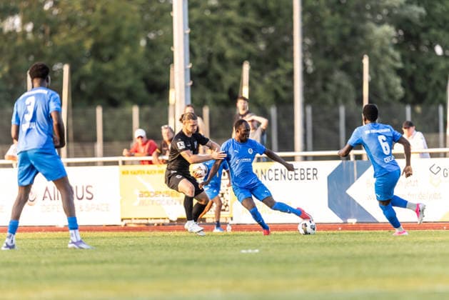 VfB Friedrichshafen vs. SSV Ulm 1846 Soccer, Wfv Cup, 2nd Round, Zeppelinstadion Friedrichshafen, July 29, 2026; from left: Dennis Chessa (SSV Ulm 1846), soccer; 11, Mulai Danfa Fati (VfB Friedrichshafen), 07 VfB Friedrichshafen vs. SSV Ulm 1846 Soccer, WfV Cup, 2nd Round, Zeppelinstadion Friedrichshafen, July 29, 2026. Photo by Lucca Fundel, Friedrichshafen, Zeppelinstadion, Baden-Württemberg, Germany