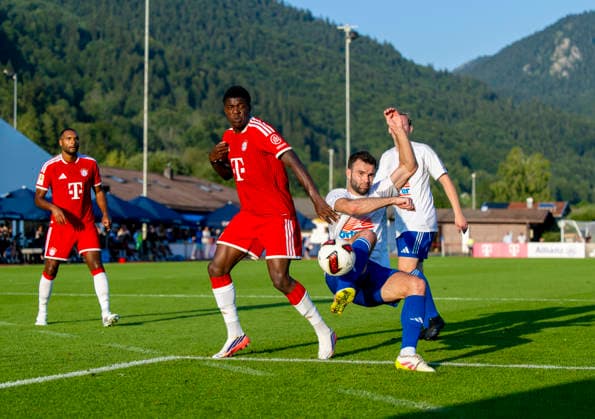 July 30, 2026, 2026–2027 Bundesliga, FC Bayern Munich training camp in Rottach Egern on Lake Tegernsee, Bavaria; friendly match between FC Rottach Egern and FC Bayern Munich; Bastian Assomo (left); FC Bayern Munich in a tackle
