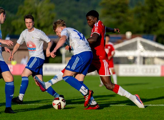 July 30, 2026, 2026–2027 Bundesliga, FC Bayern Munich training camp in Rottach Egern on Lake Tegernsee, Bavaria; friendly match between FC Rottach Egern and FC Bayern Munich; Bastian Assomo of FC Bayern Munich in a tackle
