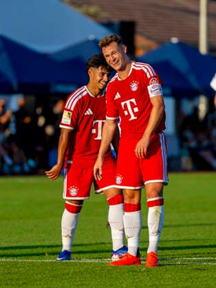 July 30, 2026, 2026–2027 Bundesliga, FC Bayern Munich training camp in Rottach-Egern on Lake Tegernsee, Bavaria; friendly match between FC Rottach-Egern and FC Bayern Munich; from left: Maycon Cardozo (FC Bayern Munich) and Joshua Kimmich (FC Bayern Munich) laughing