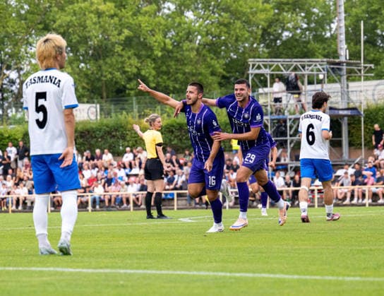 Soccer, Men s, 2026–2027 Season, Northeast Regional League, Matchday 2, SV Tasmania Berlin vs. FC Erzgebirge Aue, from left: Rintaro Yajima (Tasmania), Patrick Kapp (Aue), Stylianos Kokovas (Aue), celebration after the 0–1 goal, July 31, 2026, Copyright: xSebastianxRäppold MatthiasxKochx