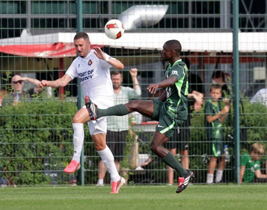 Sael Kumbedi of VfL Wolfsburg faces off against Rui Mendes of SC Telstar; Soccer, Men s, 2026–2027 Season, 2nd Division, VfL Wolfsburg vs. SC Telstar, Friendly Match, Preseason, 3–1 DFL REGULATIONS PROHIBIT ANY USE OF PHOTOGRAPHS AS IMAGE SEQUENCES AND OR QUASI-VIDEO