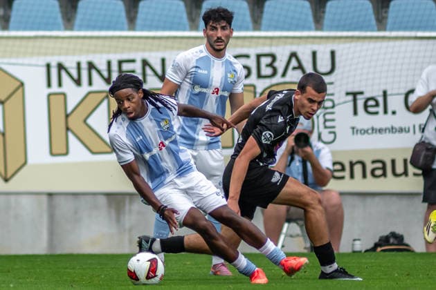 Chemnitz, Germany, July 31, 2026; Northeast Regional League 2026–2027, Matchday 2: Chemnitzer FC vs. BFC Preussen. Pictured, from left, in a tackle: Ken Tchouangue (CFC), Domenico Alberico (CFC), and Ede Gramberg (BFC) Copyright: xFotostandx xNachtigallx