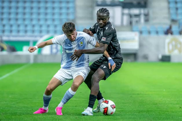 Chemnitz, Germany, July 31, 2026; Northeast Regional League 2026–2027, Matchday 2: Chemnitzer FC vs. BFC Preussen. Pictured, from left, in a tackle: Domenico Alberico (CFC) and Oluwaseunnla Eni Owo Adekunle (BFC). Copyright: xFotostandx xNachtigallx