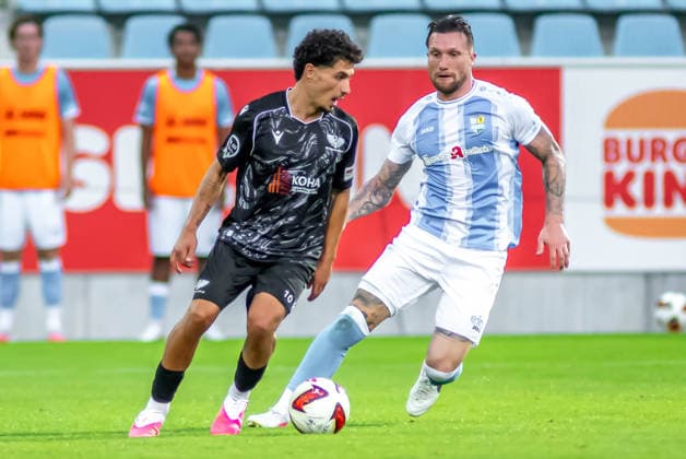 Chemnitz, Germany, July 31, 2026; Northeast Regional League 2026–2027, Matchday 2: Chemnitzer FC vs. BFC Preussen. Pictured, from left, in a tackle: Maurice Covic (BFC) and Jan Löhmannsröben (CFC). Copyright: xFotostandx xNachtigallx
