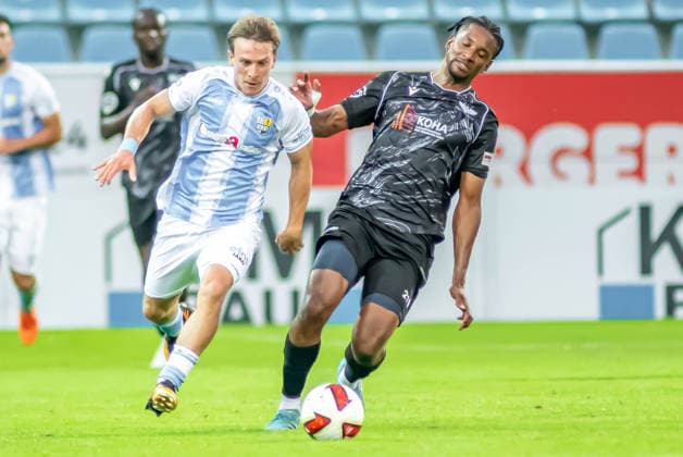 Chemnitz, Germany, July 31, 2026; Northeast Regional League 2026–2027, Matchday 2: Chemnitzer FC vs. BFC Preussen. Pictured, from left, in a tackle: Maximilian Fesser (CFC) and Charmaine Häusl (BFC). Copyright: xFotostandx xNachtigallx
