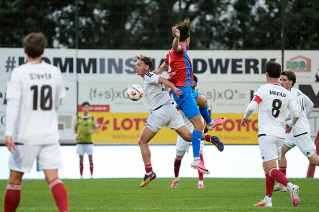 Photo by Michel Dammeier: Phönix takes a shot against Christopher SCHEPP (right), Drochtersen Soccer, Regionalliga Nord, Matchday 1 on Fri, July 31, 2026: SV Drochtersen 2, Phönix Lübeck 1