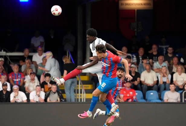 Photo by Christopher SCHEPP: Drochtersen heads the ball against Karim Hüneburg of Phönix; above: Regional League North soccer, Matchday 1 on Fri, July 31, 2026—SV Drochtersen Phönix Lübeck 2–1