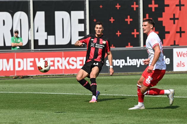 Patrik SCHICK (LEV) hits the post, action, tackle against Luca BAZZOLI (RWE) Soccer, Bundesliga 1, Testspiel, testmatch, friendly match, Bayer Leverkusen vs. Rot-Weiss Essen on August 1, 2026, in Leverkusen, Germany. DFL regulations prohibit any use of photographs as image sequences and or quasi-video.