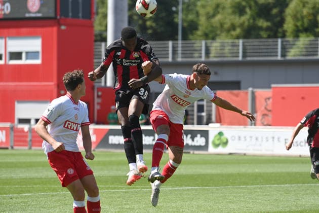 Christian KOFANE (LEV) Heading duel, action, tackle, against Luca BAZZOLI (RWE) Soccer, 1. Bundesliga, Testspiel, testmatch, friendly match, Bayer Leverkusen LEV Red-White Essen 3–0, on August 1, 2026, in Leverkusen, Germany. DFL regulations prohibit any use of photographs as image sequences and or quasi-video.