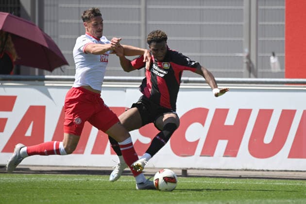 Axel TAPE LEV vs. Luca BAZZOLI RWE Action, Tackle, Soccer, Bundesliga 1, Friendly Match, Bayer Leverkusen (LEV) vs. Rot-Weiss Essen 3–0, on August 1, 2026, in Leverkusen, Germany. DFL regulations prohibit any use of photographs as image sequences and or quasi-video.