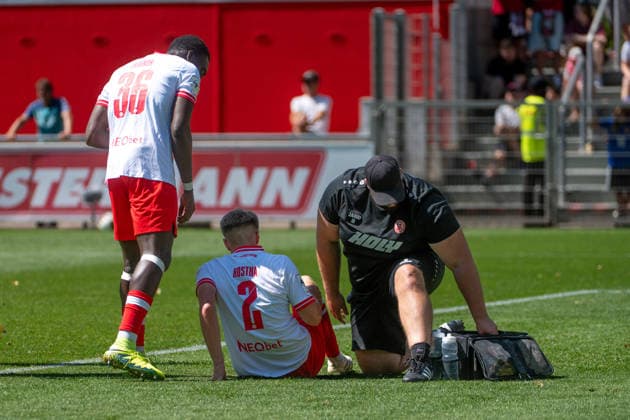 Friendly Match: Bayer 04 Leverkusen vs. Rot Weiss Essen, on August 1, 2026, Ulrich Haberland Stadium, Leverkusen; James Gnagnon (Rot Weiss Essen, 36) and Michael Kostka (Rot Weiss Essen, 2) are lying injured on the ground. Friendly match: Bayer 04 Leverkusen vs. Rot Weiss Essen, August 1, 2026, Ulrich Haberland Stadium, Leverkusen Copyright: xBEAUTIFULxSPORTS Erlhofx