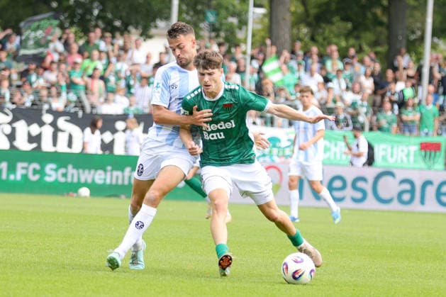 August 1, 2026, Men s Soccer, 2026–2027 Season, Bavarian Regional League, Matchday 2: 1 FC Schweinfurt 1905 vs. TSV 1860 Munich. From left: Raphael Wach (TSV 1860 Munich), 08 against Lauris Bausenwein of FC Schweinfurt 05, 21 Schweinfurt Riedel Bau Arena at Sachs Stadio, Bavaria, Lower Franconia, Germany