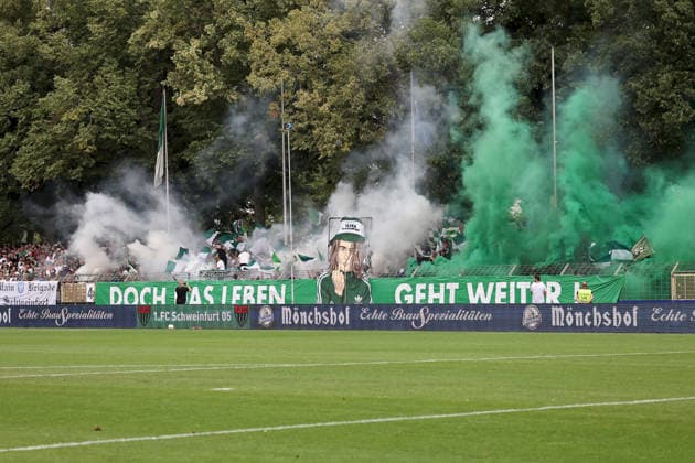 August 1, 2026, Men s, Soccer, 2026–2027 Season, Bavarian Regional League, Matchday 2: 1 FC Schweinfurt 1905 vs. TSV 1860 Munich. Choreography by the Schnüdel Fans. But Life Goes On. Schweinfurt, Sachs Stadium, Bavaria, Germany