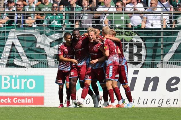 August 26, 2026, GER, Regionalliga Nord, Soccer, Matchday 1, 2026–2027 Season, Dietmar Scholze Stadium at the Lohmuehle, VfB Lübeck vs. SC Weiche Flensburg Goal celebration Cheering Goal scorer(s) Kevin Ntika SC Weiche Flensburg 08 05 celebrates the goal that tied the game at 1–1 Photo: nordphoto GmbH Tauchnitz Lübeck Dietmar Scholze Stadium an der Lohmuehle, SH, Germany Copyright: xnordphotoxGmbHx xTauchnitzx
