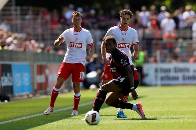 Soccer Friendly Match: Bayer 04 Leverkusen vs. Rot Weiss Essen on August 1, 2026, at Ulrich Haberland Stadium. Players: Marvin Obuz (Rot Weiss Essen), Max Geschwill (Rot Weiss Essen), Jeanuel Belocian (Bayer 04 Leverkusen)