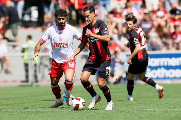 Soccer Friendly Match: Bayer 04 Leverkusen vs. Rot Weiss Essen on August 1, 2026, at Ulrich Haberland Stadium. Ekin Celebi (Rot Weiss Essen), Lucas Vazquez (Bayer 04 Leverkusen)