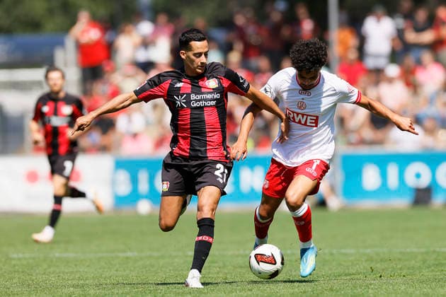 Soccer Friendly Match: Bayer 04 Leverkusen vs. Rot Weiss Essen on August 1, 2026, at Ulrich Haberland Stadium. Lucas Vazquez (Bayer 04 Leverkusen), Aiman Dardari (Rot Weiss Essen)